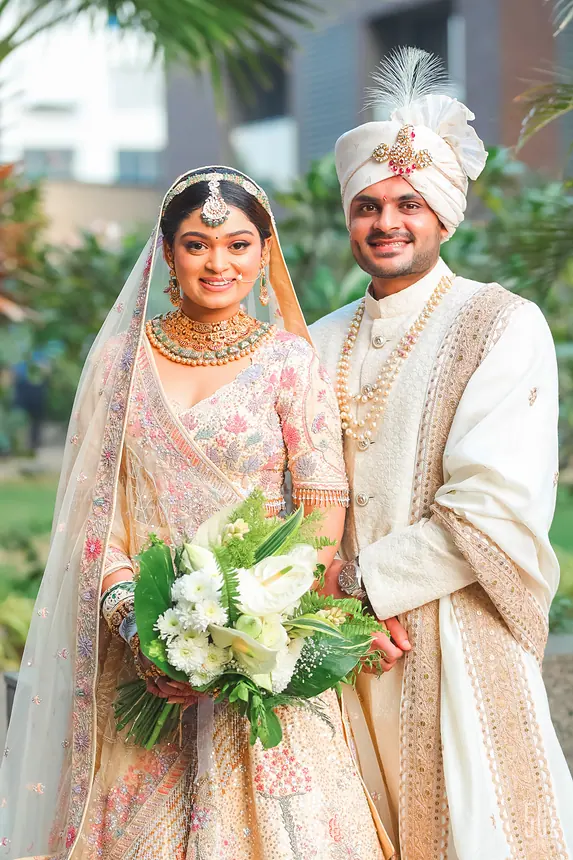 Bride and groom with a white bouquet