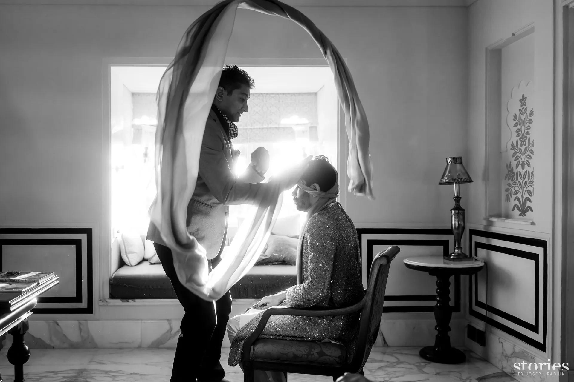 Kishore draping the groom's shawl